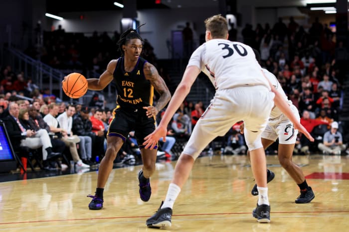 Jan 11, 2023; Cincinnati, Ohio, USA; East Carolina Pirates guard Javon Small (12) controls the ball against the Cincinnati Bearcats in the second half at Fifth Third Arena. Mandatory Credit: Aaron Doster-USA TODAY Sports